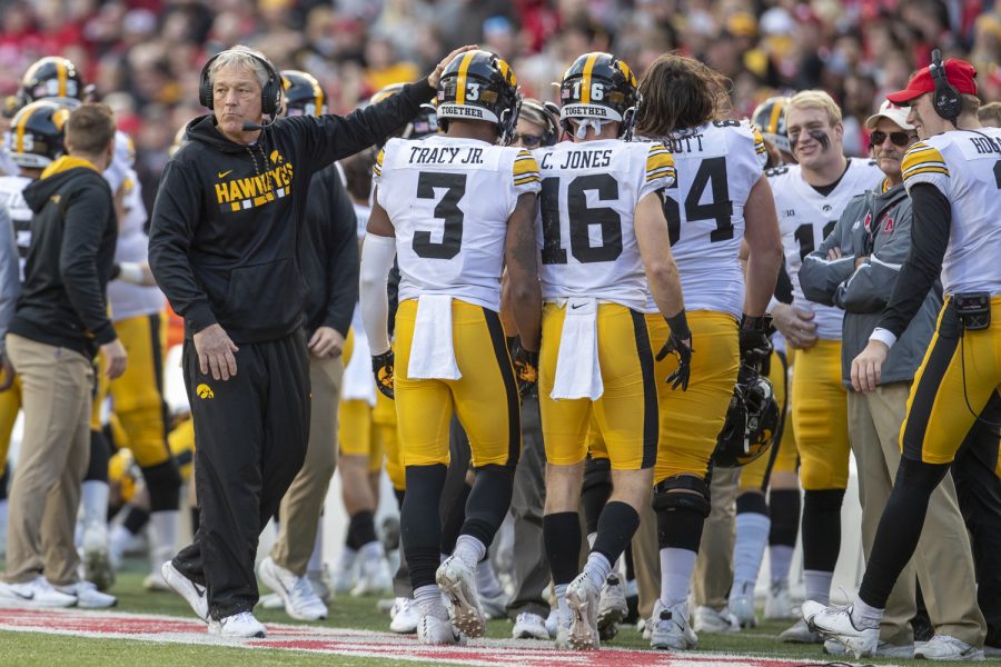 Iowa head coach Kirk Ferentz pats wide receiver Tyrone Tracy Jr.’s helmet during a football game between No. 16 Iowa and Nebraska at Memorial Stadium in Lincoln, Nebraska, on Friday, Nov. 26, 2021. Ferentz has never lost to Nebraska head coach Scott Frost. The Hawkeyes defeated the Cornhuskers 28-21.