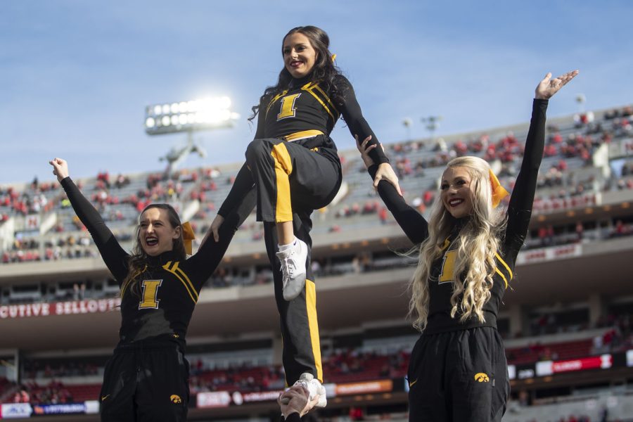 The Iowa Spirit Squad does a stunt during a football game between No. 16 Iowa and Nebraska at Memorial Stadium in Lincoln, Nebraska, on Friday, Nov. 26, 2021. The Hawkeyes defeated the Cornhuskers 28-21.