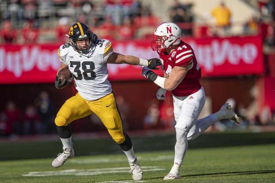 Iowa+fullback+Monte+Pottebaum+carries+the+ball+during+a+football+game+between+No.+16+Iowa+and+Nebraska+at+Memorial+Stadium+in+Lincoln%2C+Nebraska%2C+on+Friday%2C+Nov.+26%2C+2021.+The+Hawkeyes+defeated+the+Corn+Huskers+28-21.+%28Grace+Smith%2FThe+Daily+Iowan%29
