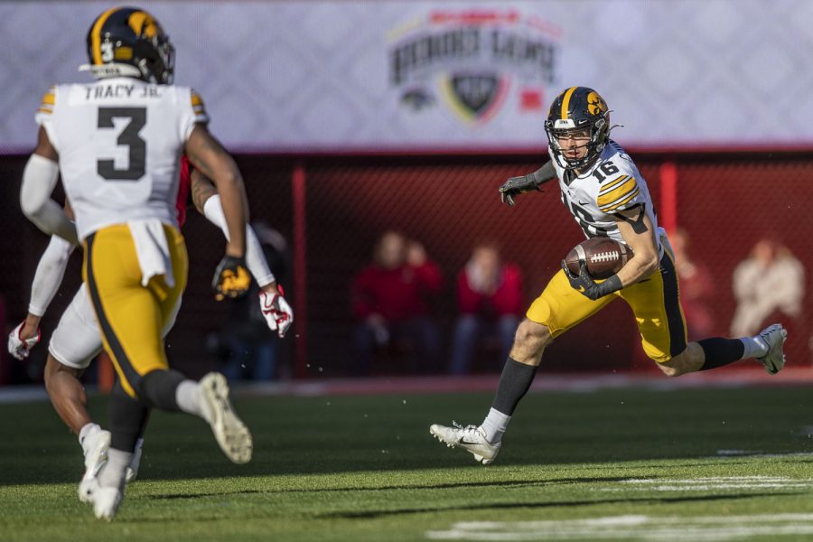 Iowa wide receiver Charlie Jones runs the ball during a football game between No. 16 Iowa and Nebraska at Memorial Stadium in Lincoln, Nebraska, on Friday, Nov. 26, 2021. The Hawkeyes defeated the Corn Huskers 28-21. 