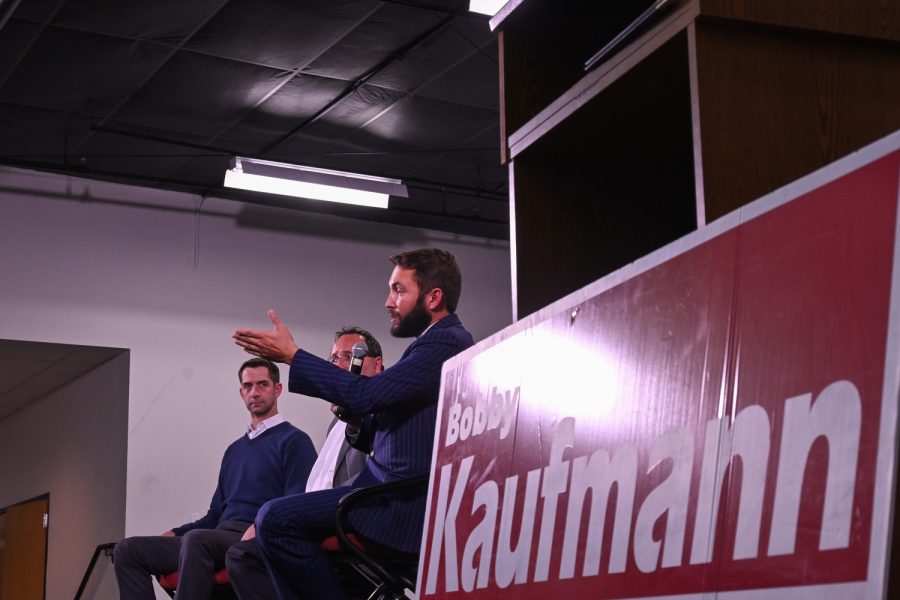 Senator Tom Cotton, former Iowa House Representative Jeff Kaufmann and his son, current Iowa House Representative  Bobby Kaufmann speak on points regarding their plans for improvement for the state and the country as a whole. (Braden Ernst/The Daily Iowan)