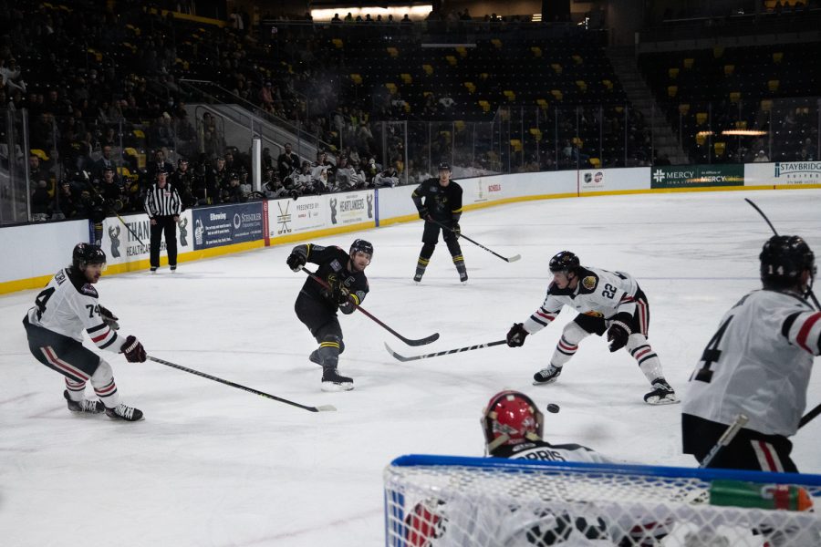Iowa forward Kris Bennett shoots the puck during a hockey game between the Iowa Heartlanders and Indy Fuel at the Xtream Arena in Coralville, Iowa on Friday, Nov. 12, 2021. Bennet scored two goals. Iowa won 5-3. 