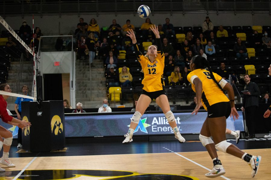 Setter Bailey Ortega sets the ball during a volleyball game between the Iowa Hawkeyes and Indiana Hoosiers at the Xtream Arena in Coralville, Iowa on Friday, Nov. 5, 2021. The Hawkeyes beat the Hoosiers 3-1. 