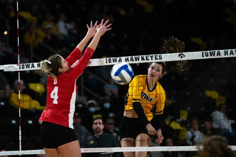 Rightside hitter Courtney Buzzerio spikes the ball during a volleyball game between the Iowa Hawkeyes and Indiana Hoosiers at the Xtream Arena in Coralville, Iowa on Friday, Nov. 5, 2021. The Hawkeyes beat the Hoosiers 3-1. 
