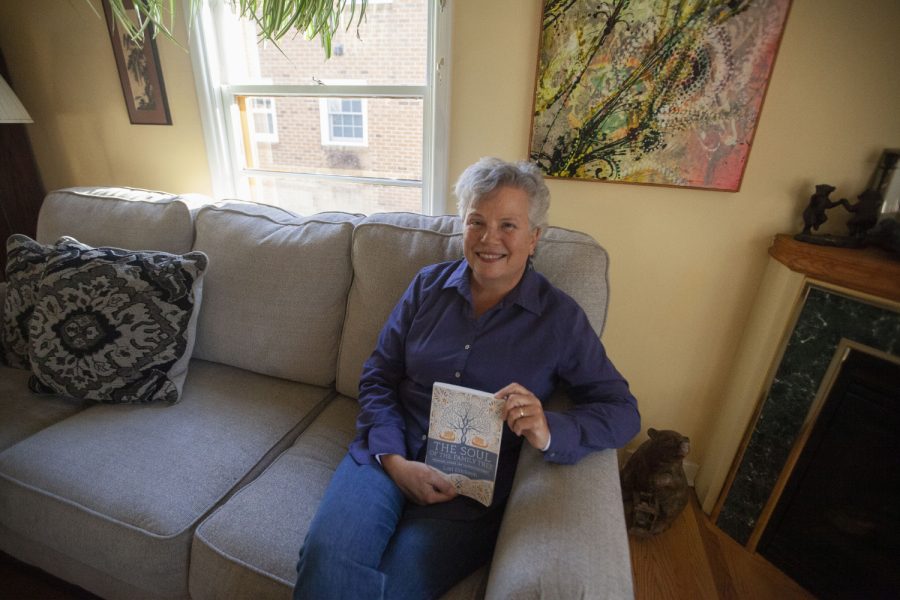 Author Lori Erickson poses for a portrait with her new book “The Soul of the Family Tree: Ancestors, Stories, and the Spirits We Inherit” in Iowa City on Wednesday, Nov. 17, 2021. 