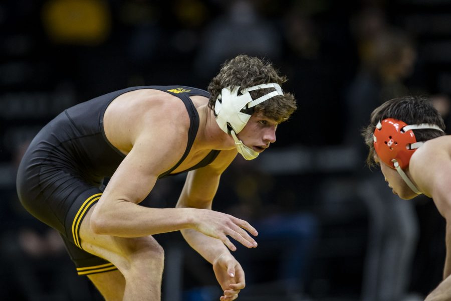 Iowa’s 149-pound Cobe Siebrecht works for inside control against Princeton’s Josh Breeding during a season opener dual wrestling meet between No. 1 Iowa and No. 21 Princeton at Carver-Hawkeye Arena on Friday, Nov. 19, 2021. Siebrecht won by tech fall 16-1. The Hawkeyes defeated the Tigers with a team score of 32-12.