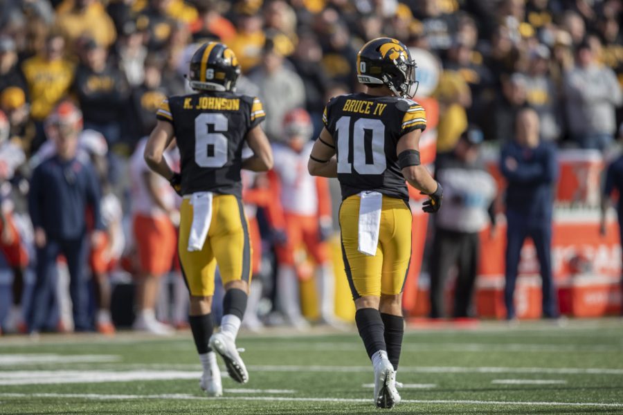 Iowa wide receivers Keagan Johnson and Arland Bruce IV run to their positions on the line during a football game between No. 17 Iowa and Illinois at Kinnick Stadium in Iowa City on Saturday, Nov. 20, 2021. The Hawkeyes defeated the Illini 33-23 at the last home game of the season. 