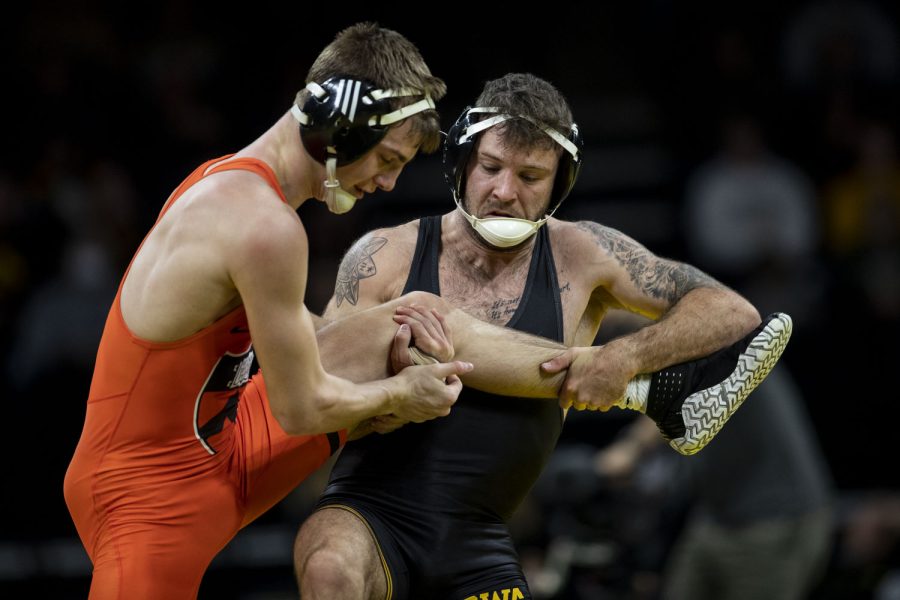 Iowa’s 141-pound Haydin Eierman grapples with Princeton’s Jacob Mann during a season opener dual wrestling meet between No. 1 Iowa and No. 21 Princeton at Carver-Hawkeye Arena on Friday, Nov. 18, 2021. Eierman won by major decision  14-5. The Hawkeyes defeated the Tigers with a team score of 32-12.
