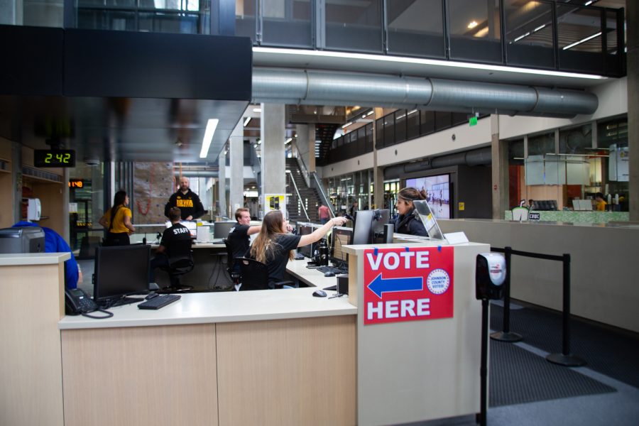 A sign inviting voters to the polls is seen inside the University of Iowa Campus Recreation and Wellness Center polling location on Election Day on Tuesday, Nov. 2, 2021. 