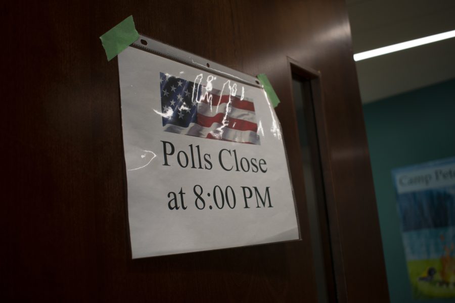 A “Polls Close at 8:00 pm” sign is seen at Petersen Residence Hall on Tuesday, Nov. 2, 2021. 