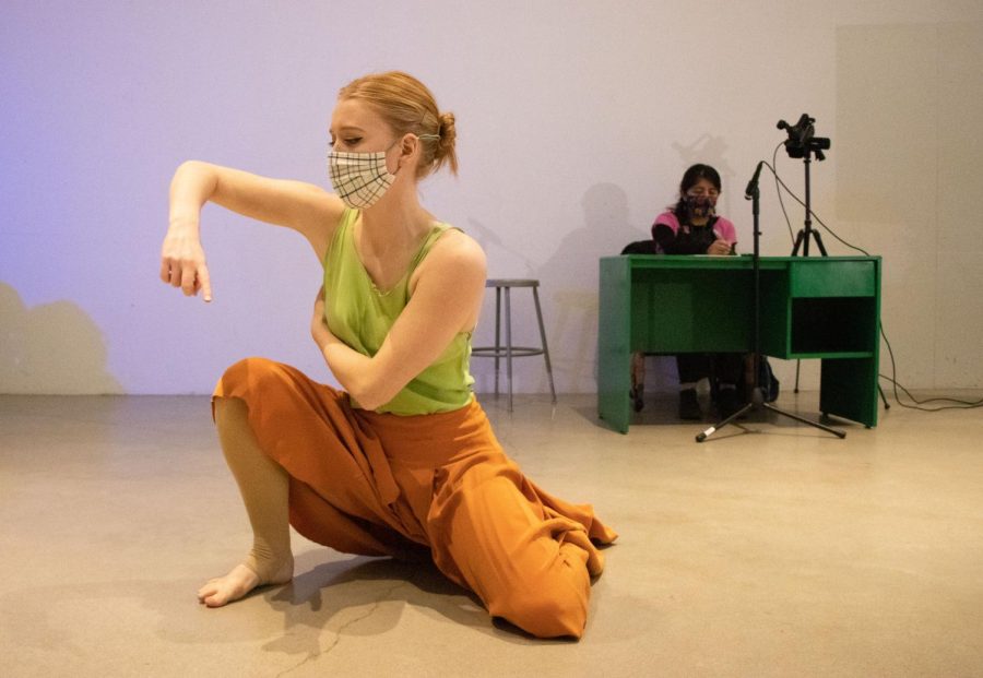 University of Iowa graduate student Emmalee Hallinan performs in the act “Apapachio” during the How, Now, To Care? International Writing and Dance Performance in the Visual Arts Building atrium on Tuesday, Nov. 9, 2021. The act is based on the written work of Diana Del Angel. 
