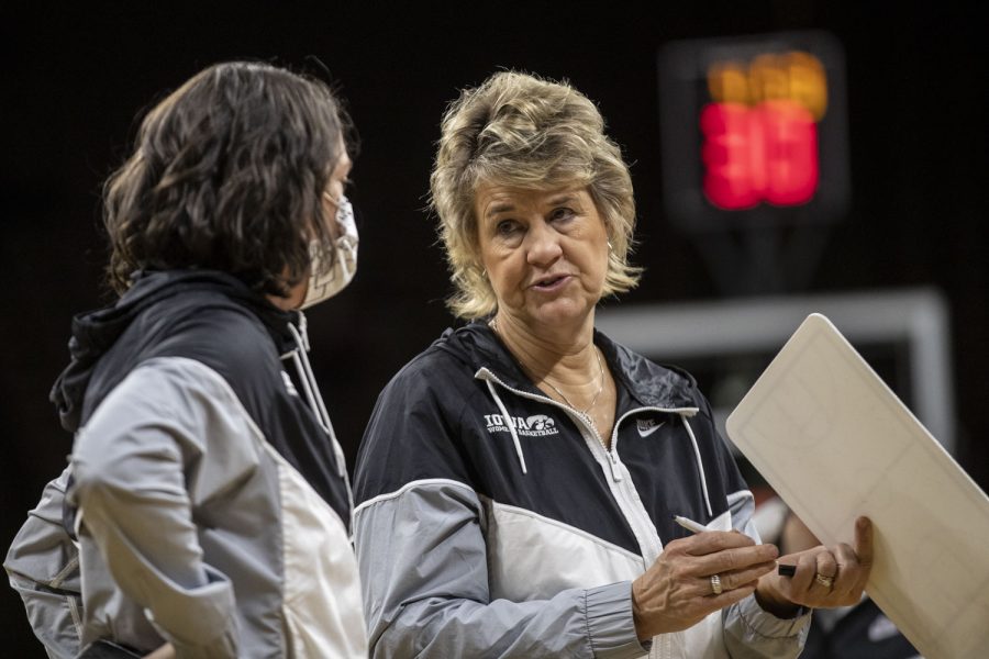 Iowa+head+coach+Lisa+Bluder+talks+with+assistant+coach+Abby+Stamp+during+a+women%E2%80%99s+basketball+game+between+No.+8+Iowa+and+Southern+University+at+Carver-Hawkeye+Arena+on+Wednesday%2C+Nov.+17%2C+2021.+The+Hawkeyes+defeated+the+Jaguars+87-67.+After+this+win%2C+Bluder+has+reached+a+total+of+799+wins+in+her+career.