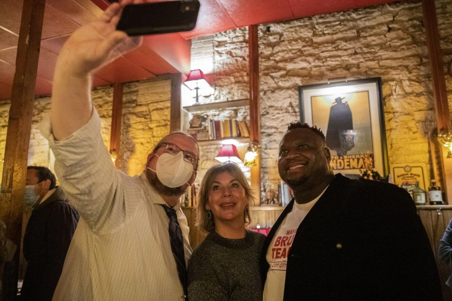 City Councilors-elect Shawn Harmsen, Megan Alter, and Mayor Bruce Teague take a selfie at a watch party for Iowa City City Council candidates Megan Alter and Shawn Harmsen at Sanctuary in Iowa City on Tuesday, Nov. 2, 2021.