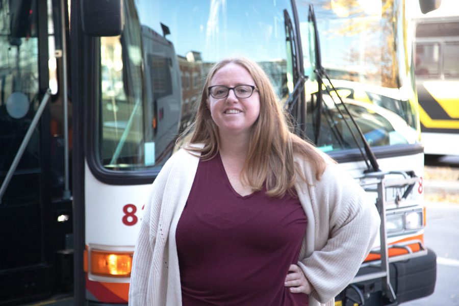 Johnson County Mobility Coordinator Kelly Schneider poses in front of Iowa City Buses at the Downtown Interchange in Iowa City on November 09 2021.