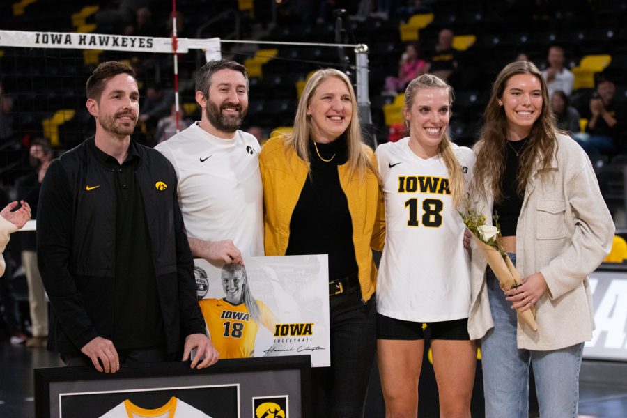 Iowa middle blocker Hannah Clayton poses for a portrait with her family and assistant coaches William Tatge and Dave Brown on senior night before the volleyball match against Maryland at Xtream Arena in Coralville on Saturday, Nov. 13, 2021. The Hawkeyes beat the Terrapins 3-1.