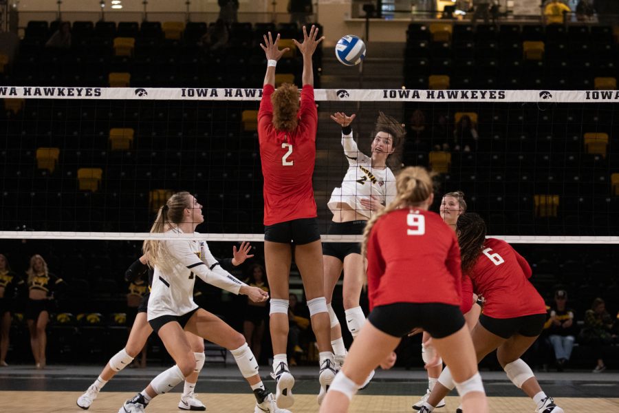 Iowa rightside hitter Courtney Buzzerio spikes the ball during a volleyball match between Iowa and Maryland at Xtream Arena in Coralville on Saturday, Nov. 13, 2021. Buzzerio recorded 23 kills. The Hawkeyes beat the Terrapins 3-1.