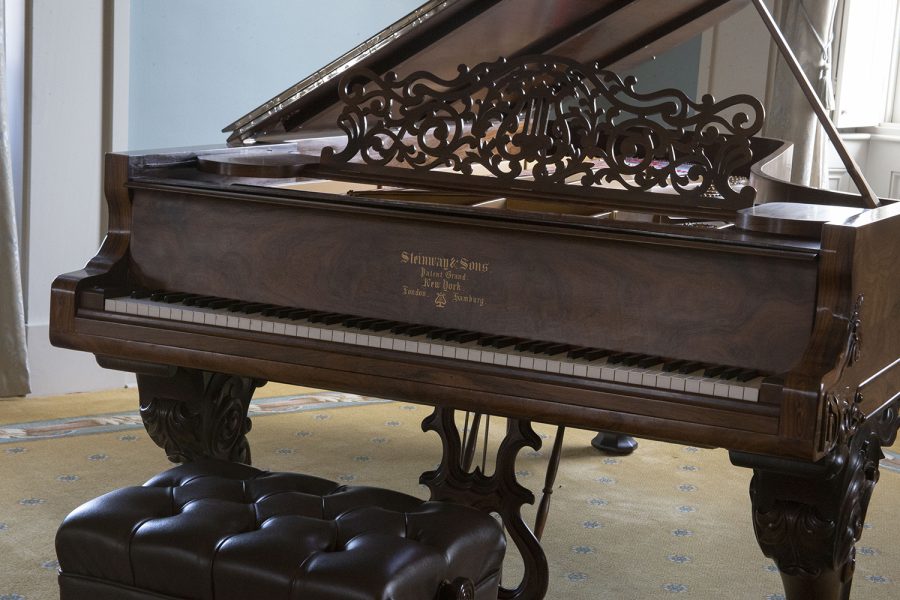 Pictured is the old captiol’s historic grand piano named “Rose” where both students and faculty showcase their skills as piano Sundays return to the old capital museum for the 2021 season.