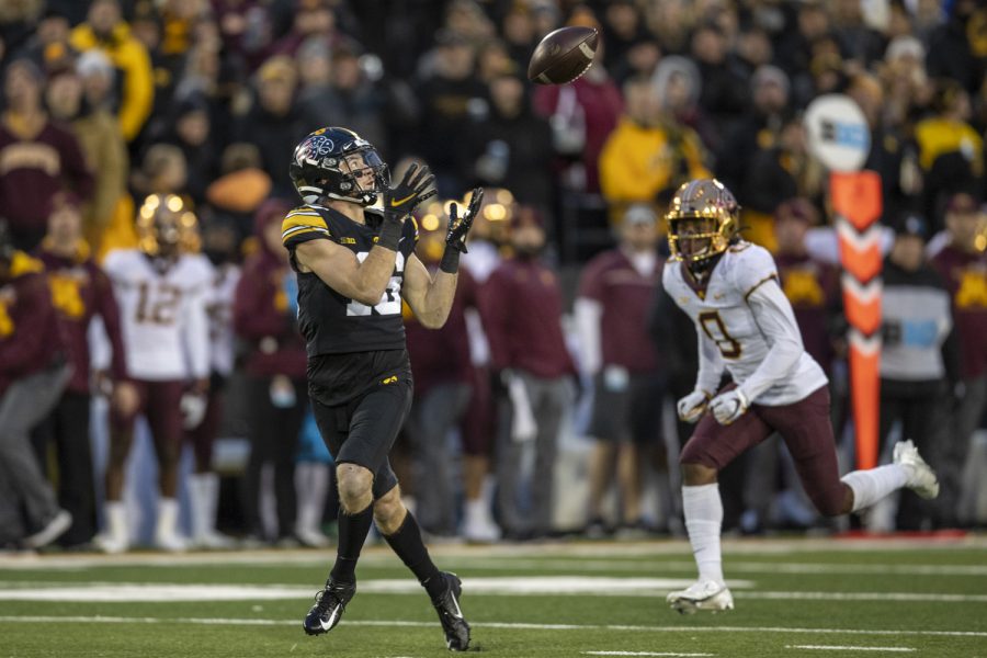 Iowa wide receiver Charlie Jones puts his hands up to catch a pass during a football game between Iowa and Minnesota at Kinnick Stadium in Iowa City on Saturday, Nov. 13, 2021. Jones caught two passes for 106 yards.The Hawkeyes defeated the Gophers 27-22.
