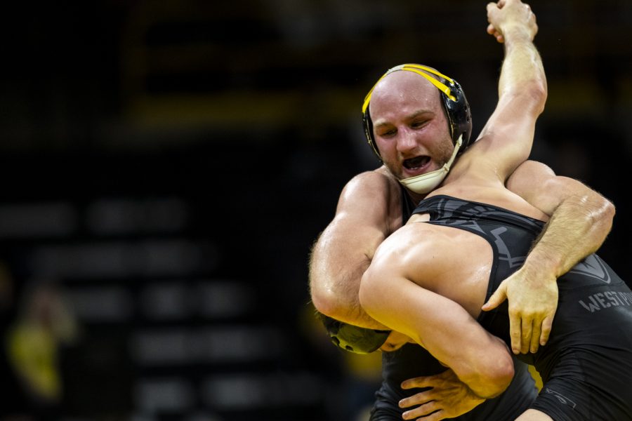 Iowa%E2%80%99s+No.+1+165-pound+Alex+Marinelli+fights+for+hand+positioning+with+Army%E2%80%99s+Christian+Hunt+during+a+wrestling+meet+between+No.+1+Iowa+and+Army+at+Carver-Hawkeye+Arena+in+Iowa+City+on+Sunday%2C+Nov.+28%2C+2021.+Marinelli+improved+to+6-0+following+the+victory.+The+Hawkeyes+defeated+the+Black+Knights+36-7.+
