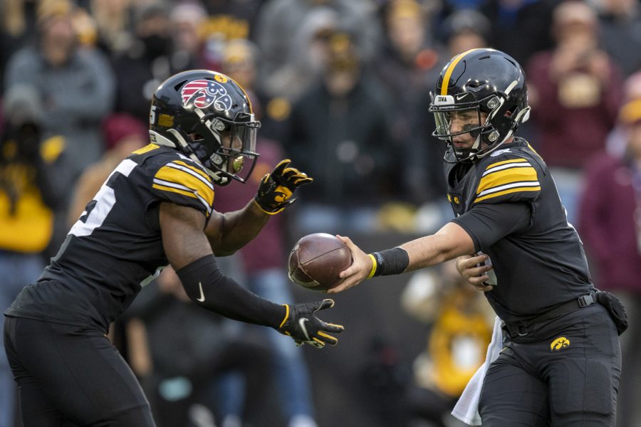 Iowa+quarterback+Alex+Padilla+hands+the+ball+off+to+running+back+Tyler+Goodson+during+a+football+game+between+Iowa+and+Minnesota+at+Kinnick+Stadium+in+Iowa+City+on+Saturday%2C+Nov.+13%2C+2021.+Goodson+rushed+for+59+yards+on+18+carries.The+Hawkeyes+defeated+the+Gophers+27-22.