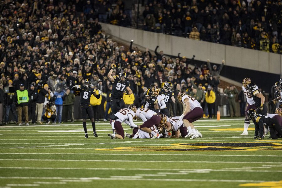 The Iowa defense celebrates after a big play during a football game between No. 19 Iowa and Minnesota at Kinnick Stadium on Saturday, Nov. 13, 2021. The Hawkeyes defeated Gophers 27-22.