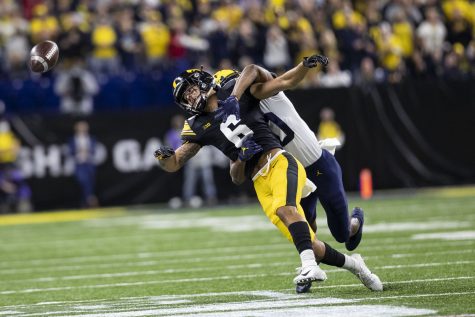 Iowa wide receiver Keagan Johnson attempts to catch a pass during the Big Ten Championship game between No. 13 Iowa and No. 2 Michigan at Lucas Oil Stadium in Indianapolis, Indiana, on Saturday, Dec. 4, 2021.