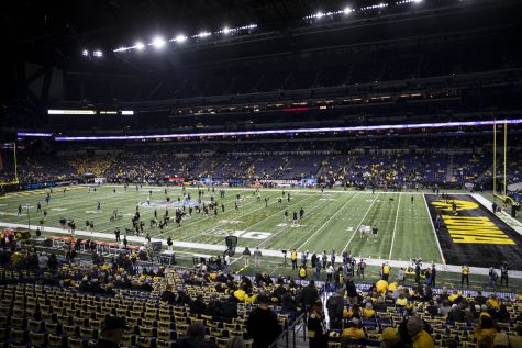 Iowa and Michigan warm up before the Big Ten Championship game between No. 13 Iowa and No. 2 Michigan at Lucas Oil Stadium in Indianapolis, Indiana, on Saturday, Dec. 4, 2021.
