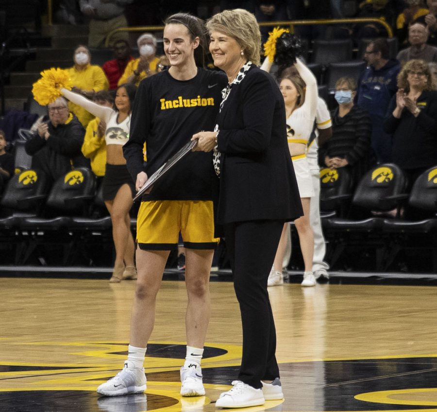 Iowa guard Caitlin Clark is celebrated in a ceremony before a women’s basketball game between No. 9 Iowa and Michigan State at Carver-Hawkeye Arena in Iowa City on Sunday Dec. 5, 2021. The Hawkeyes defeated the Trojans 88-61. 