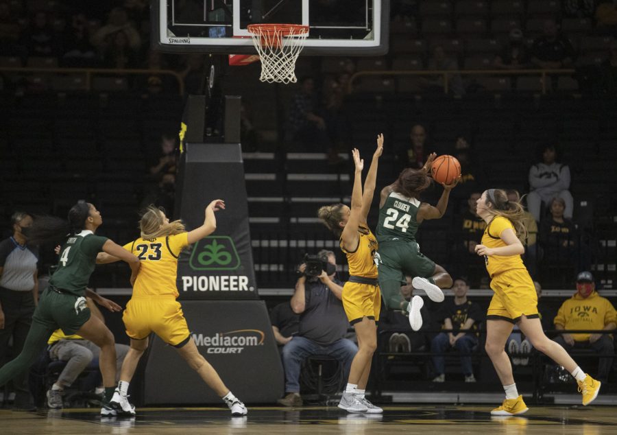 Michigan State guard Nia Clouden shoots a layup. Clouden finished with 18 points, leading the scoring for the Trojans during a women’s basketball game between No. 9 Iowa and Michigan State at Carver-Hawkeye Arena in Iowa City on Sunday, Dec. 5, 2021. The Hawkeyes defeated the Trojans, 88-61. (Dimia Burrell/The Daily Iowan)