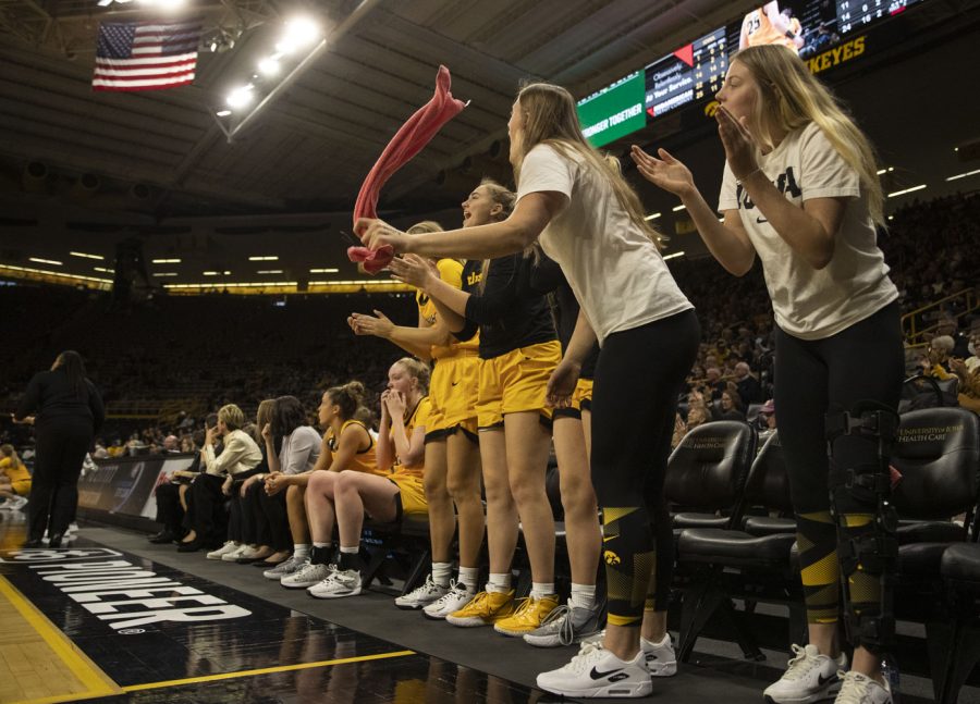 Iowa’s bench celebrates on the sideline during a women’s basketball game between No. 9 Iowa and Michigan State at Carver-Hawkeye Arena in Iowa City on Sunday Dec. 5, 2021. The Hawkeyes defeated the Trojans 88-61. (Dimia Burrell/The Daily Iowan)