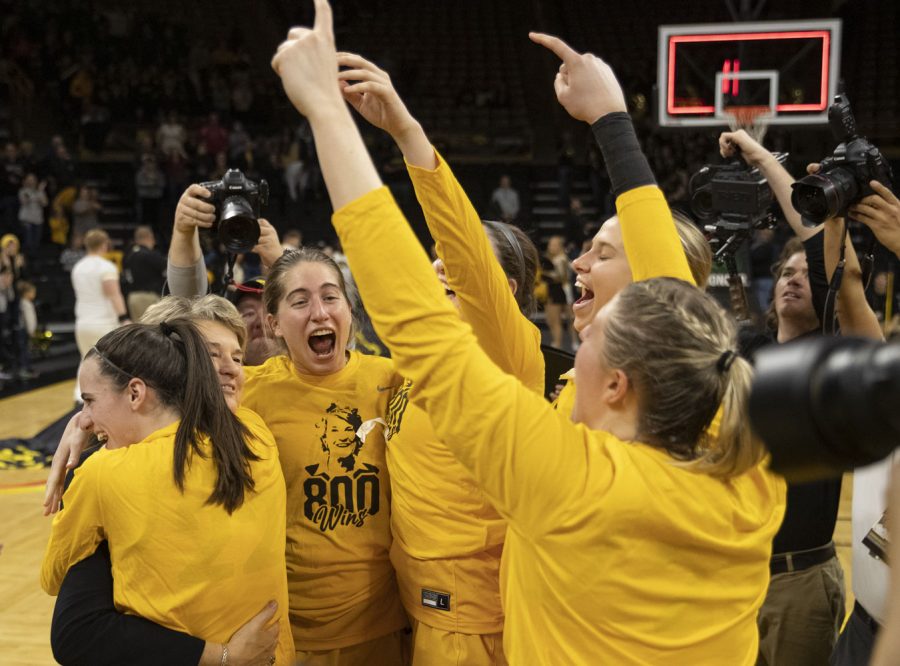 Iowa guard Caitlin Clark hugs head coach Lisa Bluder as Iowa celebrates Bluder’s 800th win after a women’s basketball game between No. 9 Iowa and Michigan State at Carver-Hawkeye Arena in Iowa City on Sunday Dec. 5, 2021. The Hawkeyes defeated the Trojans 88-61. (Dimia Burrell/The Daily Iowan)