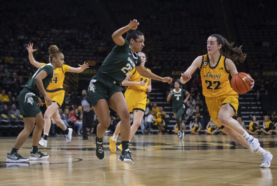 Iowa guard Caitlin Clark drives to the basket during a women’s basketball game between No. 9 Iowa and Michigan State at Carver-Hawkeye Arena in Iowa City on Sunday Dec. 5, 2021. Clark lead the team in scoring with 24 points, helping the Hawkeyes defeat the Trojans, 88-61. 