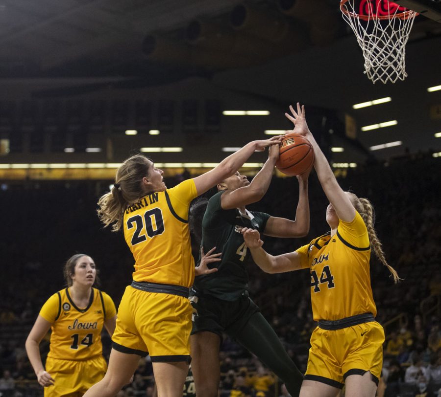 Michigan State forward Alisia Smith gets double teamed by Iowa guard Kate Martin and forward Addison O’Grady. The Hawkeyes had 3 blocks. O’Grady had one during a women’s basketball game between No. 9 Iowa and Michigan State at Carver-Hawkeye Arena in Iowa City on Sunday Dec. 5, 2021. The Hawkeyes defeated the Trojans, 88-61. 