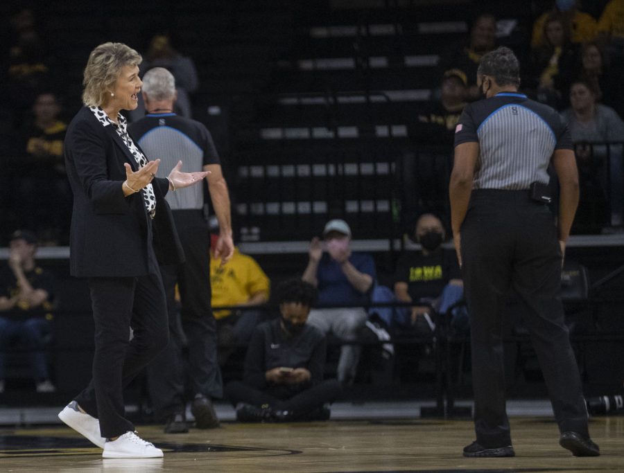 Iowa head coach Lisa Bluder debates with the referee over a foul called against Iowa. The Hawkeyes and the Trojans both finished with 17 personal fouls during a women’s basketball game between No. 9 Iowa and Michigan State at Carver-Hawkeye Arena in Iowa City on Sunday, Dec. 5, 2021. The Hawkeyes defeated the Trojans, 88-61. 