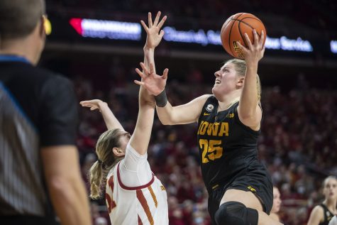 Iowa center Monika Czinano goes in for a layup during a women’s basketball game between No. 12 Iowa and No. 15 Iowa State at Hilton Coliseum in Ames, Iowa, on Wednesday, Dec. 8, 2021. Czinano shot 5-13 in field goals. Monika Czninano averages 19.3 points per game. 