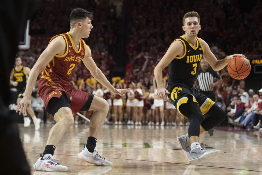 Iowa guard Jordan Bohannon drives to the basket. Bohannon led Iowa in scoring with 17 points during a men’s basketball game between Iowa and No. 17 Iowa State at Hilton Coliseum in Ames on Thursday, Dec. 9, 2021. The Cyclones defeated the Hawkeyes, 73-53.