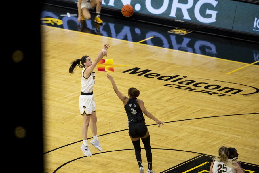 Iowa guard Caitlin Clark puts up a shot during a women’s basketball game between No. 14 Iowa and Central Florida in Carver-Hawkeye Arena on Saturday, Dec. 18, 2021. Clark led the team in scoring with 21 points. The Hawkeyes defeated the Knights, 69-61.