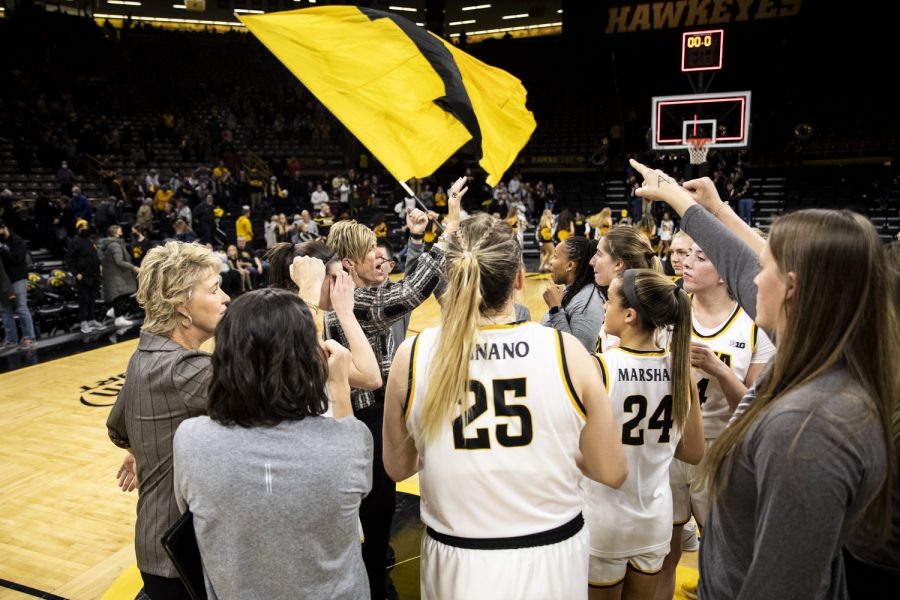 Iowa huddles up after a win during a women’s basketball game between No. 14 Iowa and Central Florida in Carver-Hawkeye Arena on Saturday, Dec. 18, 2021. After being asked about coaching against a former Hawkeye, Iowa head coach Lisa Bluder expressed love for former Iowa players. “But we also like to send them home with an L,” Bluder said after the game. The Hawkeyes defeated the Knights, 69-61.