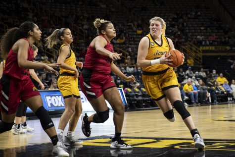Iowa center Monika Czinano drives to the hoop during a women’s basketball game between No. 15 Iowa and Indiana University-Purdue University Indianapolis at Carver-Hawkeye Arena in Iowa City on Tuesday, Dec. 21, 2021. The Jaguars defeated the Hawkeyes 74-73. Czinano led the team in points with 23. 