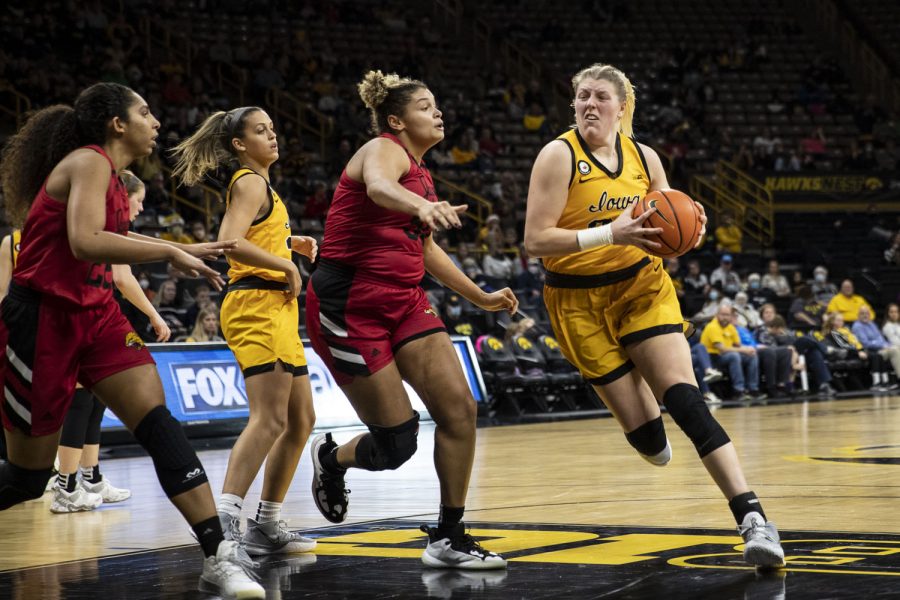Iowa+center+Monika+Czinano+drives+to+the+hoop+during+a+women%E2%80%99s+basketball+game+between+No.+15+Iowa+and+Indiana+University-Purdue+University+Indianapolis+at+Carver-Hawkeye+Arena+in+Iowa+City+on+Tuesday%2C+Dec.+21%2C+2021.+The+Jaguars+defeated+the+Hawkeyes+74-73.+Czinano+led+the+team+in+points+with+23.+