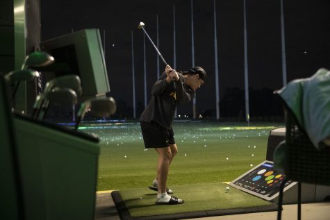 Iowa defensive back Dane Belton swings his golf club during an event at Topgolf before the 2022 Vrbo Citrus Bowl in Orlando, Fla., on Wednesday, Dec. 29, 2021. Belton spoke about his golf skills. “I feel good,” Belton said. “You know, get a chance to get out here and hit some balls and, you know, practice our golf thing… we don’t get much time to do it so it’s fun.”
