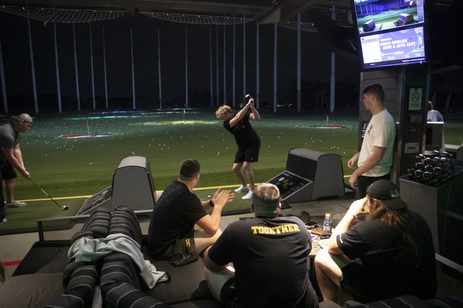 Iowa punter Tory Taylor swings a club during an event at Topgolf before the 2022 Vrbo Citrus Bowl in Orlando, Fla., on Wednesday, Dec. 29, 2021. A reporter asked Taylor how he was golfing. “Not very well for myself,” Taylor said. “Kinda hitting them everywhere…”
