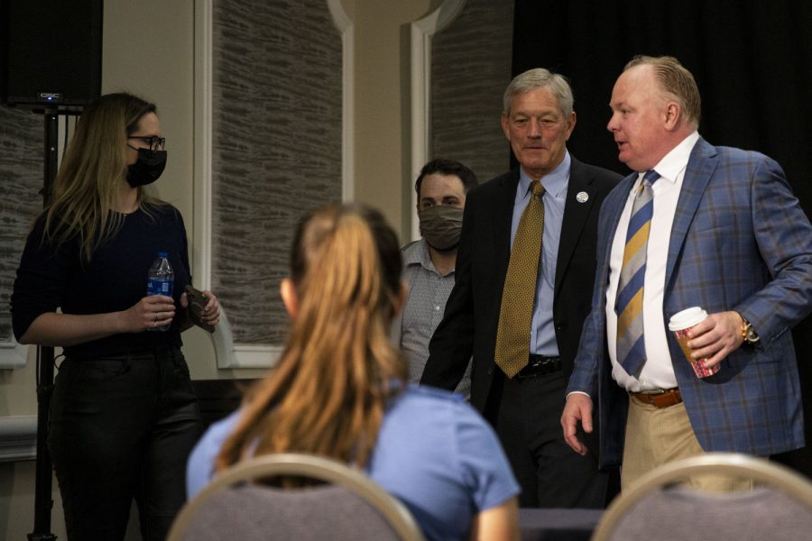 Iowa head coach Kirk Ferentz and Kentucky head coach Mark Stoops exit during a head coach press conference for the 2022 Vrbo Citrus Bowl at Rosen Plaza Hotel in Orlando, Fla., on Friday, Dec. 31, 2021.