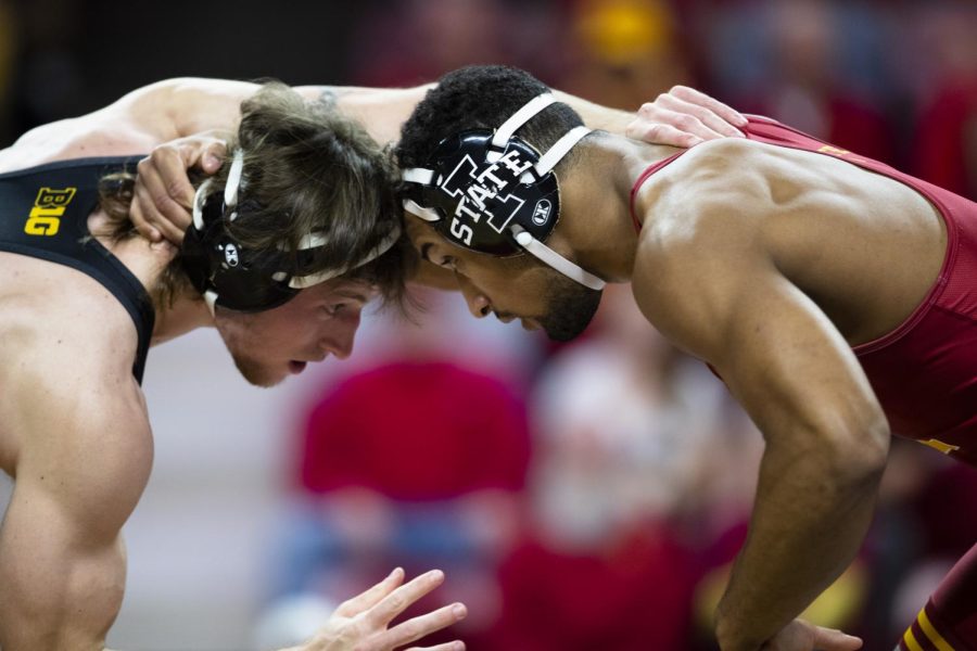 Iowas Max Murin grapples with Iowa States Ian Parker during a dual at Hilton Coliseum in Ames on December 5th, 2021. The Hawkeyes beat the Cyclones, 22-11.
