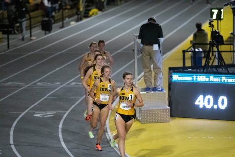 Emma Gordon leads the women’s one-mile run early during the Jimmy Grant Invitational meet at the Iowa Recreation Building in Iowa City on Saturday, Dec. 11, 2021. Members of Drake, Northern Illinois, Northern Iowa, Iowa and Wisconsin were featured at the meet. 