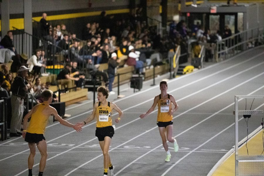 Iowa%E2%80%99s+Max+Murphy+high+fives+a+teammate+after+he+crosses+the+finish+line+of+the+one+mile+run+during+the+Jimmy+Grant+Invitational+meet+at+the+Iowa+Recreation+Building+in+Iowa+City+on+Saturday%2C+Dec.+11%2C+2021.+Members+of+Drake%2C+Northern+Illinois%2C+Northern+Iowa%2C+Iowa+and+Wisconsin+were+featured+at+the+meet.+