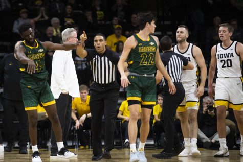 A referee ejects Southeastern Louisiana guard Keon Clergeot after a flagrant foul is called on him during a basketball game between Iowa and Southeastern Louisiana at Carver-Hawkeye Arena in Iowa City on Tuesday, Dec. 21, 2021. The Hawkeyes defeated the Lions 93-62. 