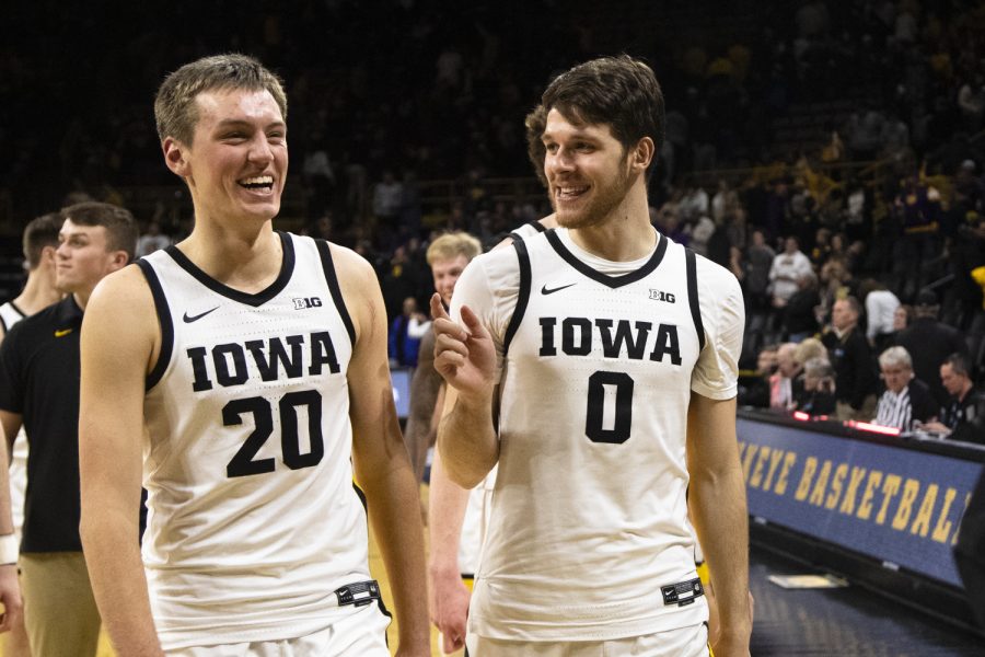 Iowa guard Payton Sandfort and Iowa forward Filip Rebraca walk off the court after a basketball game betwen Iowa and Western Illinois at Carver-Hawkeye Arena in Iowa City on Wednesday, Dec. 30, 2021. The Hawkeyes defeated the Leathernecks 92-71. 