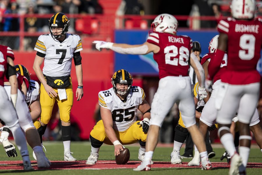 Iowa quarterback Spencer Petras lines up behind center Tyler Linderbaum during a football game between No. 16 Iowa and Nebraska at Memorial Stadium in Lincoln, Nebraska, on Friday, Nov. 26, 2021. Petras replaced quarterback Alex Padilla at the start of third quarter. The Hawkeyes defeated the Corn Huskers 28-21. 