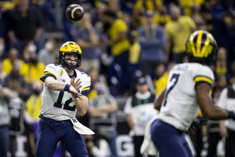 Michigan quarterback Cade McNamara throws a pass during the Big Ten Championship game between No. 13 Iowa and No. 2 Michigan at Lucas Oil Stadium in Indianapolis, Indiana, on Saturday, Dec. 4, 2021. McNamara threw for 16 completions on 24 attempts. The Wolverines became Big Ten Champions after defeating the Hawkeyes, 42-3. 